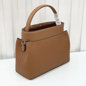 Luxury brown leather tote bag with top handle and contrast stitching for women retro style