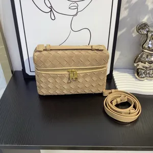 Brown suede woven leather vanity crossbody bag with top handle and metal zipper details