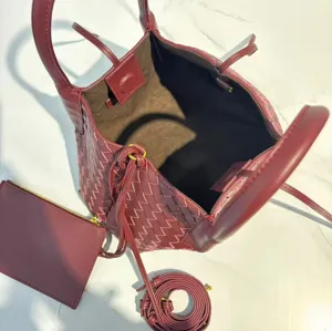 Burgundy leather woven tote bag with pouch and strap, premium handmade shoulder handbag.