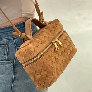 Brown suede woven crossbody bag for women, stylish vintage vanity shoulder bag with zipper.