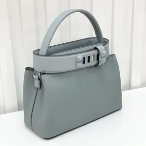 Light blue leather top handle handbag with metal pyramid stud belt stylish shoulder bag