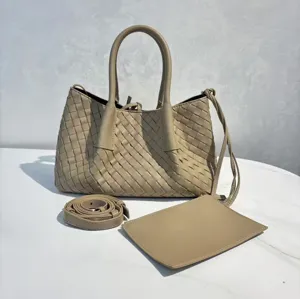 Detailed view of the woven leather tote bag featuring intricate craftsmanship and hardware.