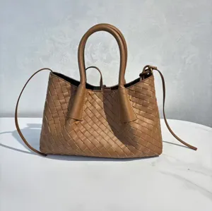 Brown woven leather detail shot of luxury shoulder bag, exquisite craftsmanship and texture.