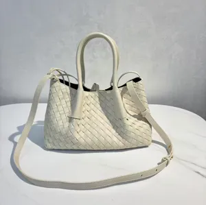 Woven leather top handle bag, stylish large capacity tote shoulder bag for women daily use.