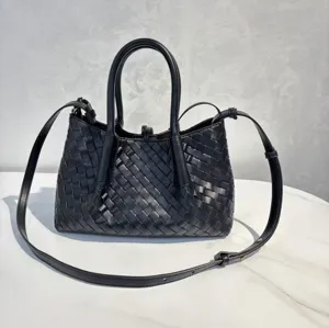 Black genuine leather woven handbag detail, classic diagonal intrecciato design with top handles.