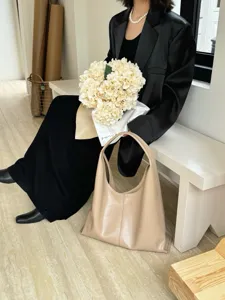 Minimalist soft leather tote bag for women, slouchy hobo shoulder bag with large capacity.