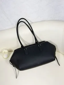 Black genuine leather bowling bag detail, minimalist design shoulder tote bag for daily.