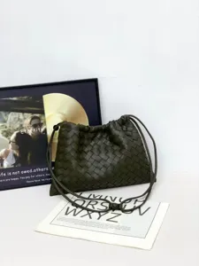 Dark green woven leather pouch bag, casual cloud crossbody bag with drawstring design for women.