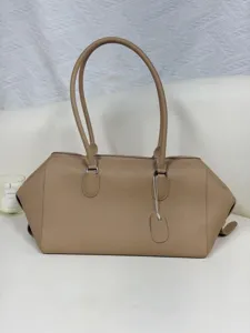 Minimalist top grain leather bowling shoulder bag, large capacity luxury commuter tote for women.