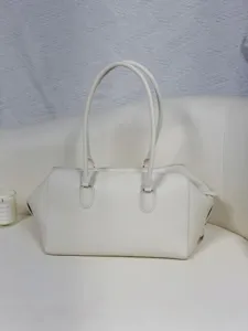Minimalist white leather EW bowling bag, large capacity commute shoulder tote for women.