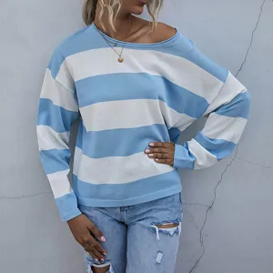 Detail view of a loose blue and white striped knit sweater for women with round neck