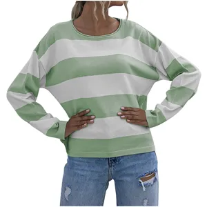 Close-up of women striped knit sweater in green and white color