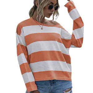 Women's loose long-sleeved knit sweater with orange and white horizontal stripes.