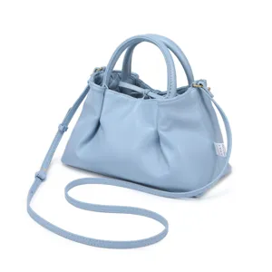 Light blue PU leather handbag with gathered design, dual top handles and crossbody strap.