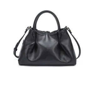 Detailed view of black leather tote bag with gathered design, dual top handles and gold hardware.