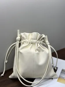 Detailed view of the soft white leather drawstring pouch bag, showing premium texture and craftsmanship.