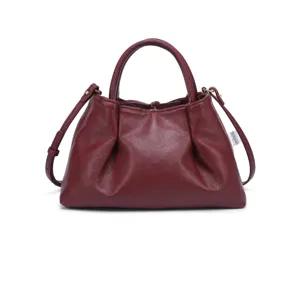 Burgundy leather tote bag detail showing soft gathered texture, top handle and strap rings.