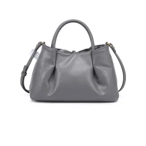 Detail view of the gray gathered leather handbag featuring metal rings and stylish strap.