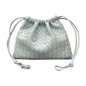 Light green leather woven drawstring pouch bag, stylish casual shoulder crossbody bag for women.