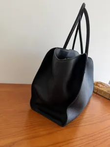 Black leather tote bag for women, large capacity minimalist shoulder commuter handbag.