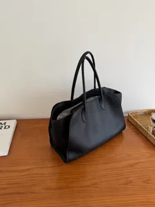 Black leather tote bag for women, large capacity minimalist shoulder handbag for daily work.