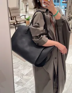 Elegant minimalist black leather tote bag for women, large capacity stylish shoulder bag.