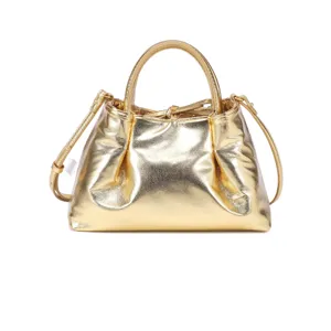 Metallic gold handbag detail, shiny ruched leather design, elegant top handle and strap.