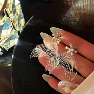 Exquisite fairy wing earrings featuring sparkling crystal flower studs, elegant detail shot.