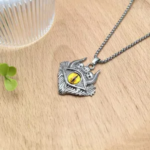 Gothic demon eye skull pendant necklace detailed view showcasing intricate metal carving and yellow eye.