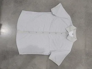 Detail view of men casual waffle short sleeve shirt with contrast lapel and pocket design.