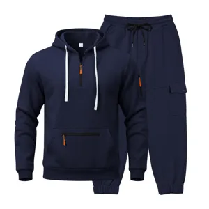 Detailed view of dark blue half-zip fleece hoodie and utility cargo sweatpants set.