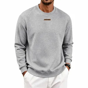 Men's fleece-lined casual grey crewneck sweatshirt with a chest patch for autumn wear.