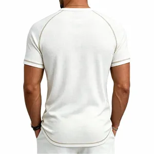 Back view detail of men's white waffle knit short sleeve t-shirt with contrast stitching.