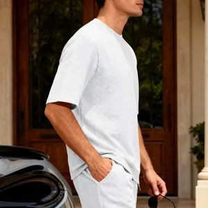 Close-up detail of men's white jacquard knit short sleeve t-shirt, casual high street style.