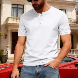 Detail shot of casual men's white Henley shirt paired with jeans in a luxury urban street scene.