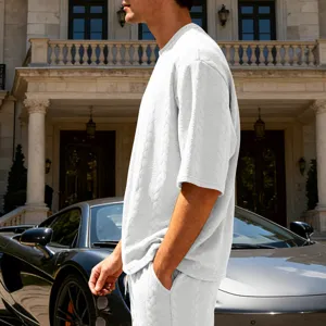 Men's oversized jacquard knit crewneck short sleeve t-shirt and shorts casual white street outfit.