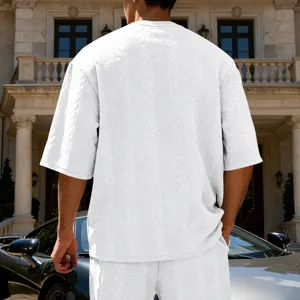 Men's casual oversized jacquard knit short sleeve t-shirt top, textured detailed view.