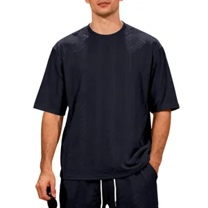 Detailed view of the textured jacquard knit fabric, men's short sleeve crewneck top.