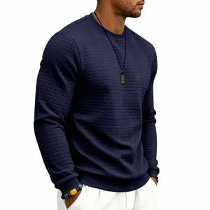 Men's navy blue waffle knit crewneck sweatshirt detail, casual long sleeve pullover top.