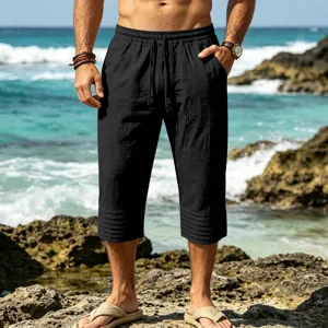Detail view of men casual cropped shorts with drawstring waist and pleat hem for summer beach.