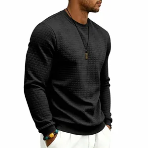 Detail shot of men's dark grey crewneck long sleeve waffle textured casual pullover shirt