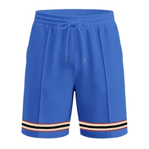 Men's casual waffle knit sports shorts with drawstring and stylish striped hem for summer.
