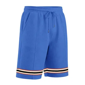 Men's blue waffle knit casual sports shorts featuring contrast striped cuffs and relaxed fit.