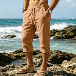Men's casual linen cotton cropped shorts with drawstring waist and pleated hem for summer beach.