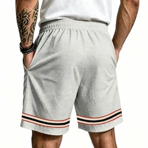 Men's casual loose waffle knit sports shorts with contrast striped cuffs, comfortable fit for summer training.
