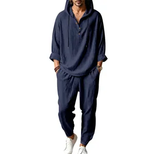 Men's casual linen hooded top and pants detail showing breathable fabric and henley button design.