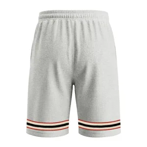 Grey waffle knit shorts detail showing contrast striped hem and elastic waist for men casual sports.