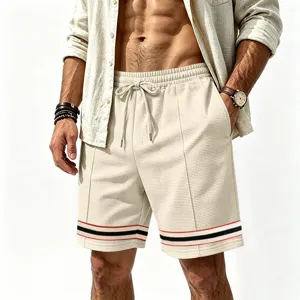 Mens waffle knit casual shorts with contrast stripe hem, drawstring waist and loose fit detail.