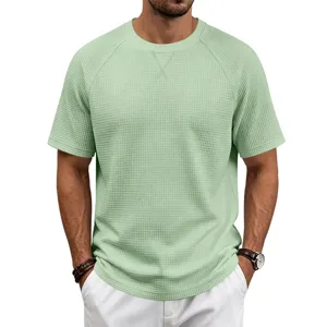 Waffle knit fabric texture detail of the casual mens green crew neck short sleeve shirt.