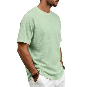 Men's light green waffle knit short sleeve t-shirt close-up showing breathable textured fabric.